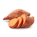 Een gesneden zoete aardappel met daarnaast een hele zoete aardappel Een gesneden zoete aardappel met daarnaast een hele zoete aardappel
